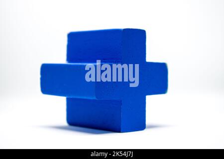 Cross geometry Made of wood laid on a white background. Stock Photo