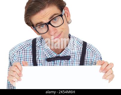 Hes not getting the response he wants. Portrait of a young man holding up a blank sign while looking somewhat disappointed. Stock Photo