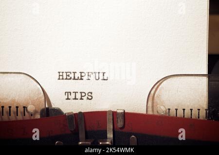 Helpful tips text written with a typewriter. Stock Photo