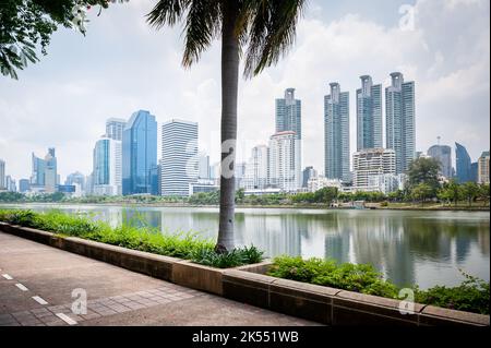 The path or road that goes around Lake Ratchada in Benjakitti Park in the centre of Bangkok, Thailand. This is used by joggers and rollerbladers. Stock Photo