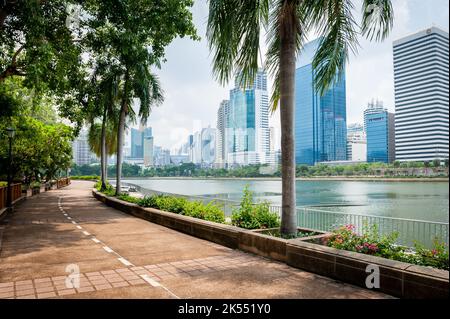 The path or road that goes around Lake Ratchada in Benjakitti Park in the centre of Bangkok, Thailand. This is used by joggers and rollerbladers. Stock Photo