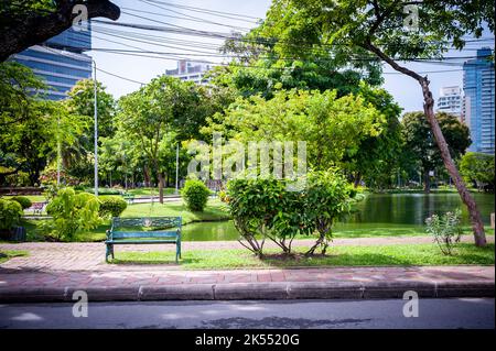 Views of the road, paths and the large lake in Lumphini Park, Bangkok, Thailand. Stock Photo