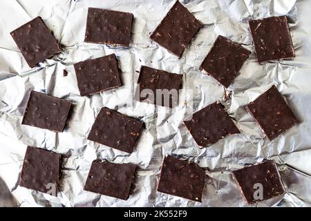 Background texture banner made of chocolate bars with nuts. The concept of harmful sweet food and diet. The concept of sweets for dessert. top view of Stock Photo