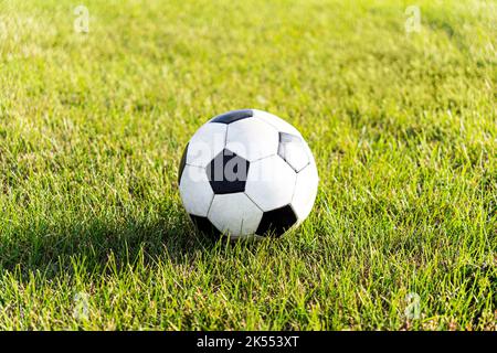 close-up view of leather soccer ball on green grass Stock Photo