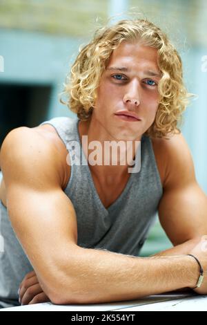 Hes hip and happening. Portrait of a handsome young man chilling outside. Stock Photo