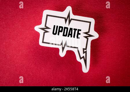 Update. Text and speech bubble on red background. Stock Photo