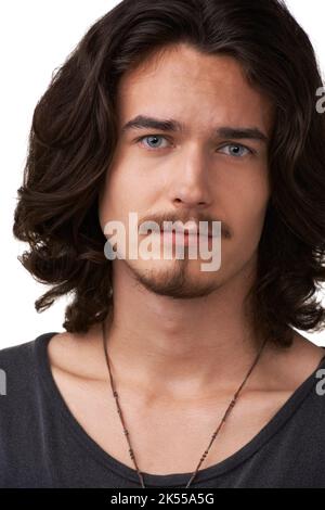 Dreamy and dashing. Closeup of a handsome young man looking straight at the camera. Stock Photo