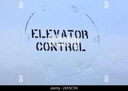 elevator control sign painted on the the side fo an old aircraft Stock Photo