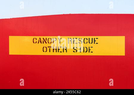 Yellow Canopy rescue other side sign with black text painted on the side of an old jet plane Stock Photo