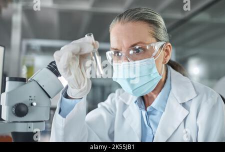 Covid lab, medical science and scientist working on futuristic medicine research for healthcare at a pharmacy. Doctor doing an expert chemical test on Stock Photo