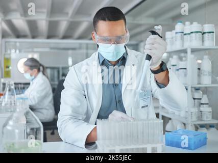 Covid lab, medical science or man scientist working on futuristic medicine research for healthcare at a laboratory. Doctor, nurse or chemical test on Stock Photo