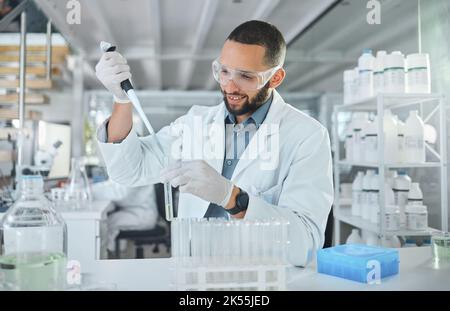 Scientist using test tube in lab for science, research and medicine. Portrait of man doing test in biotechnology, medical research and analytics in Stock Photo
