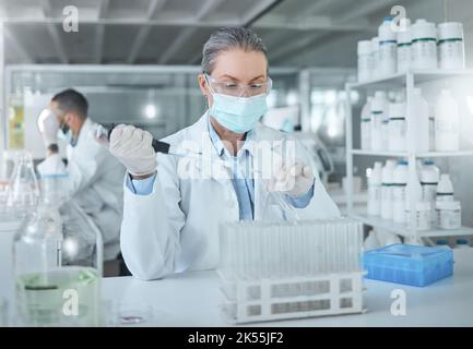Medical science, covid lab and scientist working on research for healthcare for a virus at work. Doctor in medicine with a face mask for security from Stock Photo
