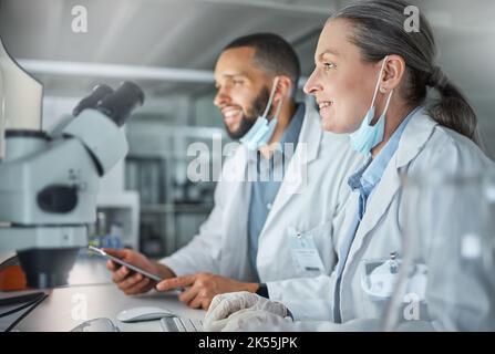 Teamwork, science and scientist working on covid research, biotechnology and dna data analysis together in laboratory. Smile, collaboration and happy Stock Photo