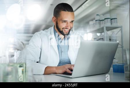 Science, research and laptop with man in laboratory working on analytics, pharmacy or medical. Innovation, internet and technology with scientist Stock Photo