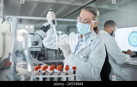 Lab research, covid science and scientist working on medical blood development for future at work. Chemistry doctor with face mask for security from Stock Photo