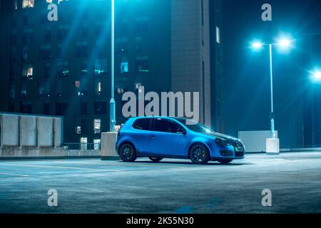 A Satin Blue Vinyl Wrapped 2006 Volkswagen Golf GTI With Dark Grey BBS Aftermarket Alloy Wheels And Yellow Brake Callipers Stock Photo