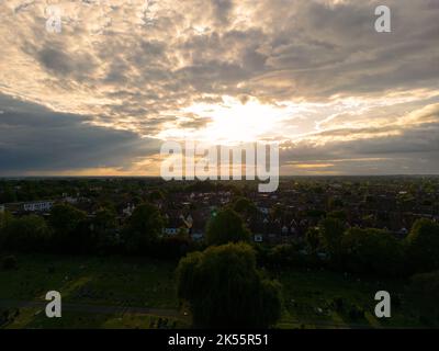 The beautiful cloudy sunset over the town. Harrow on the Hill, England, UK. Stock Photo