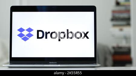 The logo of Dropbox on the laptop screen. Stock Photo