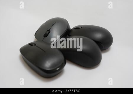 four different wireless mice on a white background Stock Photo