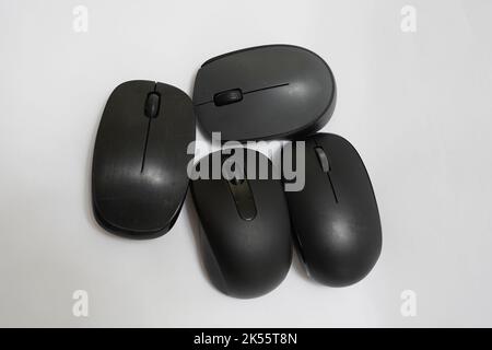 four different wireless mice on a white background Stock Photo