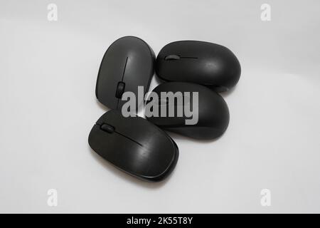 four different wireless mice on a white background Stock Photo