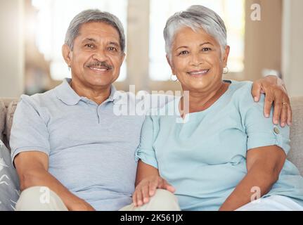Retirement couple, portrait and relax sofa lounge, love and living room lifestyle together in Australia home. Elderly, senior and happy man, smile Stock Photo