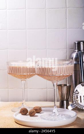 Boozy creamy Brandy Alexander Cocktail with nutmeg. Trendy autumn winter alcohol drink Stock Photo