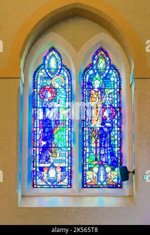 Stained glass windows in a chapel. Stock Photo