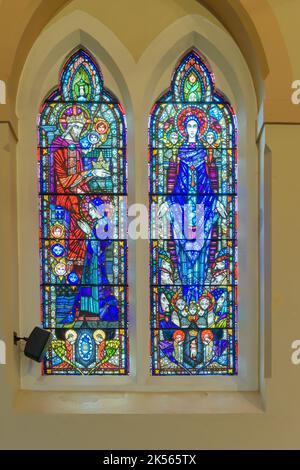 Stained glass windows in a chapel. Stock Photo