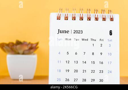 The June 2023 Monthly desk calendar for 2023 year on yellow background.