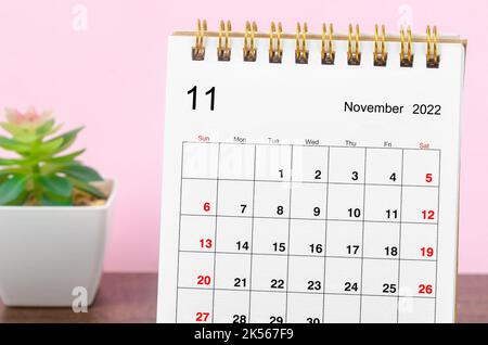 November 2022 Monthly desk calendar on wooden table. Stock Photo