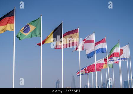 Flags of nations qualified for World Cup 2022 Qatar at Doha Corniche, Qatar. Stock Photo