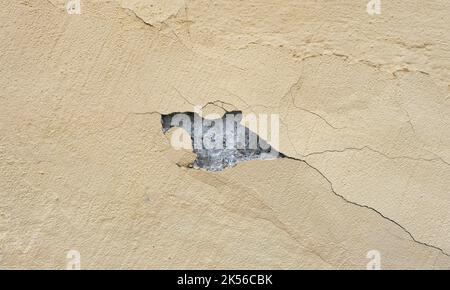 Cracked yellow wall. Stock Photo