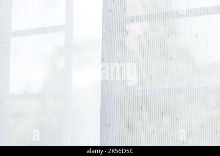 curtains or thin and transparent white curtain with texture for see through and soft light on balcony window. Stock Photo