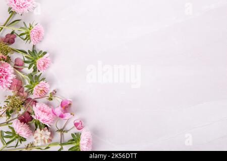 Autumn creative composition asters, hydrangea flowers on gray background. Fall, autumn background. Flat lay, top view, copy space Stock Photo
