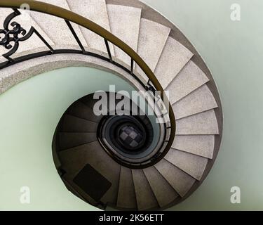 Auderghem, Brussels Capital Region - Belgium - 05 13 2021 Swirling staircase in pastel colors in a private house Stock Photo