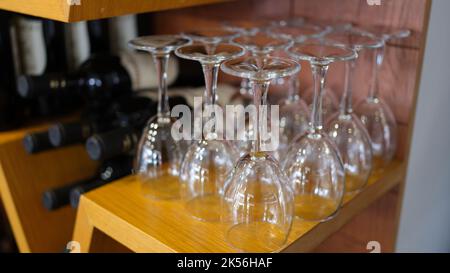 Wine bar with empty glasses and bottles of elite wine Stock Photo