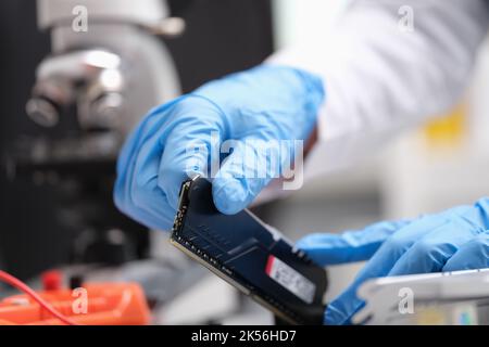 Technician repairs computer hardware and installs motherboard Stock Photo