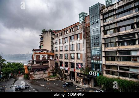 (221006) -- CHONGQING, Oct. 6, 2022 (Xinhua) -- Photo taken on Sept. 27, 2022 shows the Yichang film park, a popular scenic spot and a business incubation base transformed from former industrial site, in Yuzhong District, southwest China's Chongqing.  In recent years, Chongqing has rebuilt and renovated a large number of idle and abandoned buildings in Yuzhong District.    The renewed buildings and neighborhoods have attracted many young entrepreneurs to start their business in catering, cultural and creative industries, and also helped promote tourism in Chongqing. (Xinhua/Tang Yi) Stock Photo