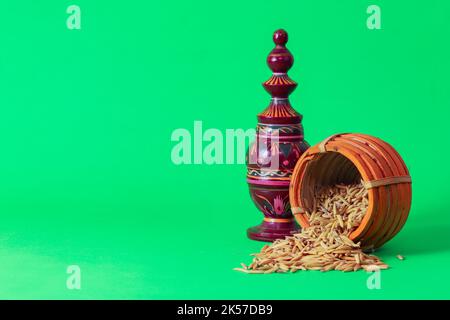 Laxmi puja essentials for rituals kept together. rice paddy grains and other objects symbolizing goddess of riches and prosperity during laxmi puja or Stock Photo