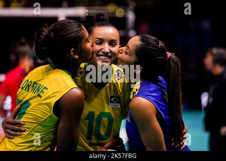 ROTTERDAM, NETHERLANDS - OCTOBER 6: Lorenne Geraldo Teixeira of Brazil, Gabriela Braga Guimaraes of Brazil and Nyeme Victoria Alexandre Costa Nunes of Brazil celebrate their teams win during the Pool E Phase 2 match between Brazil and Puerto Rico on Day 13 of the FIVB Volleyball Womens World Championship 2022 at the Rotterdam Ahoy on October 6, 2022 in Rotterdam, Netherlands (Photo by Rene Nijhuis/Orange Pictures) Stock Photo