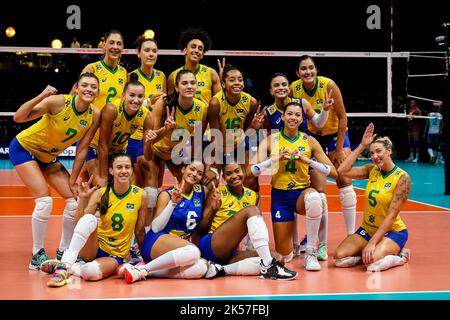 ROTTERDAM, NETHERLANDS - OCTOBER 6: Gabriela Braga Guimaraes of Brasil, Nyeme Victoria Alexandre Costa Nunes of Brasil, Caroline De Oliveira Saad Gattaz of Brasil, Macris Fernanda Silva Carneiro of Brasil, Priscilac Zalewski Daroit Moreira of Brasil, Rosamaria Montibeller of Brasil, Roberta Silva Ratzke of Brasil, Lorena GiovanaViezel of Brasil, Kisy Nascimento of Brasil, Julia Gambatto Kudiess of Brasil, Lorenne Geraldo Teixeira of Brasil, Tainara Lemes Santos of Brasil, Ana Carolina Da Silva of Brasil and Natalia Araujo of Brasil pose for a team photo after their win during the Pool E Phase Stock Photo