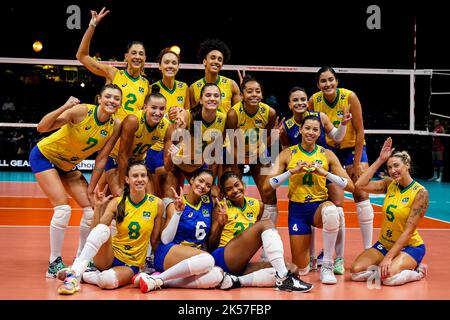 ROTTERDAM, NETHERLANDS - OCTOBER 6: Gabriela Braga Guimaraes of Brasil, Nyeme Victoria Alexandre Costa Nunes of Brasil, Caroline De Oliveira Saad Gattaz of Brasil, Macris Fernanda Silva Carneiro of Brasil, Priscilac Zalewski Daroit Moreira of Brasil, Rosamaria Montibeller of Brasil, Roberta Silva Ratzke of Brasil, Lorena GiovanaViezel of Brasil, Kisy Nascimento of Brasil, Julia Gambatto Kudiess of Brasil, Lorenne Geraldo Teixeira of Brasil, Tainara Lemes Santos of Brasil, Ana Carolina Da Silva of Brasil and Natalia Araujo of Brasil pose for a team photo after their win during the Pool E Phase Stock Photo