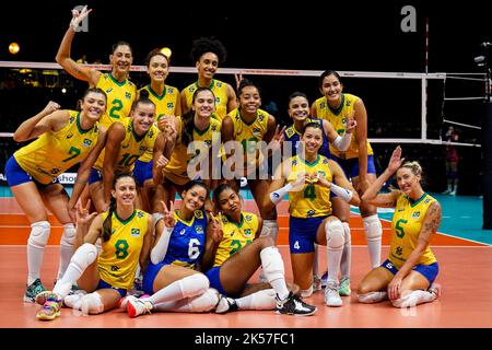 ROTTERDAM, NETHERLANDS - OCTOBER 6: Gabriela Braga Guimaraes of Brasil, Nyeme Victoria Alexandre Costa Nunes of Brasil, Caroline De Oliveira Saad Gattaz of Brasil, Macris Fernanda Silva Carneiro of Brasil, Priscilac Zalewski Daroit Moreira of Brasil, Rosamaria Montibeller of Brasil, Roberta Silva Ratzke of Brasil, Lorena GiovanaViezel of Brasil, Kisy Nascimento of Brasil, Julia Gambatto Kudiess of Brasil, Lorenne Geraldo Teixeira of Brasil, Tainara Lemes Santos of Brasil, Ana Carolina Da Silva of Brasil and Natalia Araujo of Brasil pose for a team photo after their win during the Pool E Phase Stock Photo