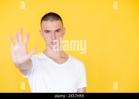 stop gesture strict man closed way serious gloomy Stock Photo