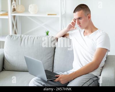 distance work unhappy man bad connection sad Stock Photo