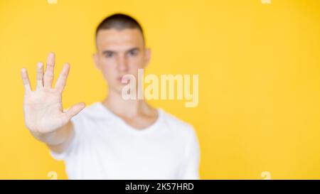 protesting gesture defocused man stop do it Stock Photo