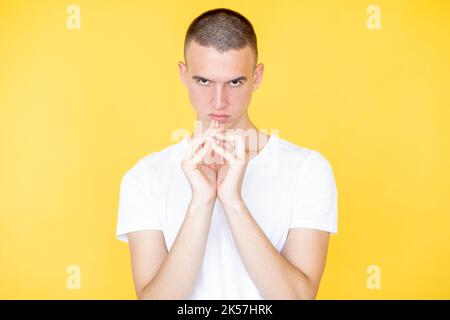 conspirator man evil plan face expression angry Stock Photo