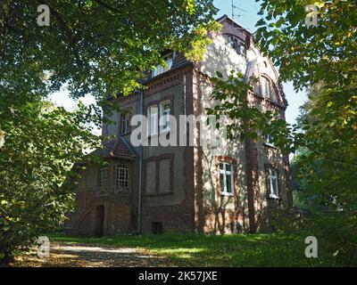 Beautiful city / public park in autumn / historical Kindler's House in Park Szachty in Poznań, Poland Stock Photo